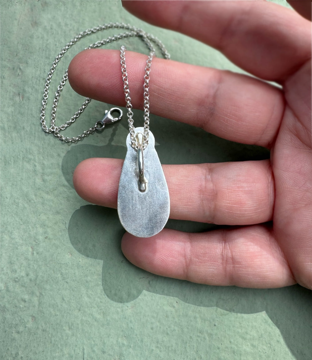 Showing the back hidden bail on the white buffalo pendant