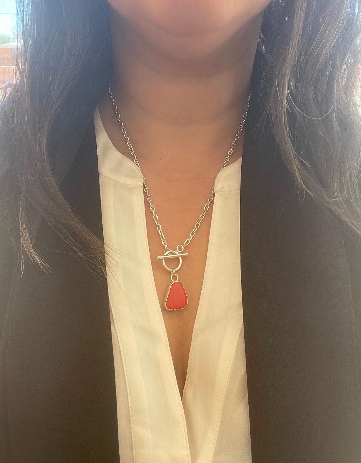 a red rosarita stone on gucci chain necklace with a front toggle clasp shown worn