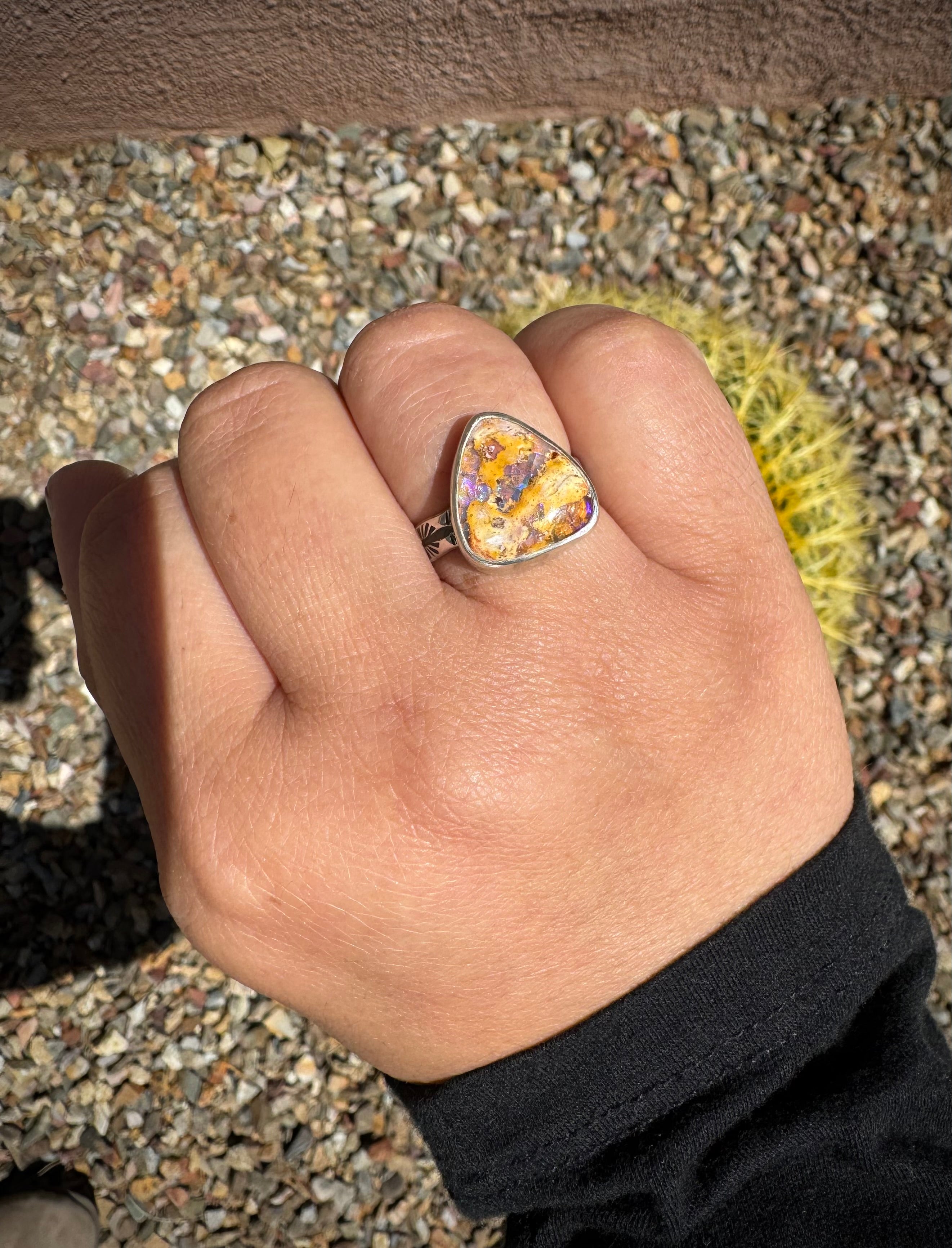 Purple Mexican fire opal handmade silver ring shown worn on the hand