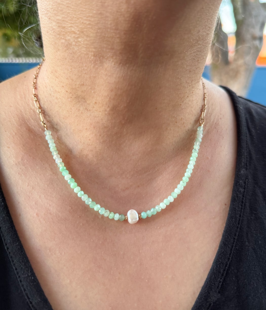 A chrysoprase and baroque pearl gold fill chain necklace worn