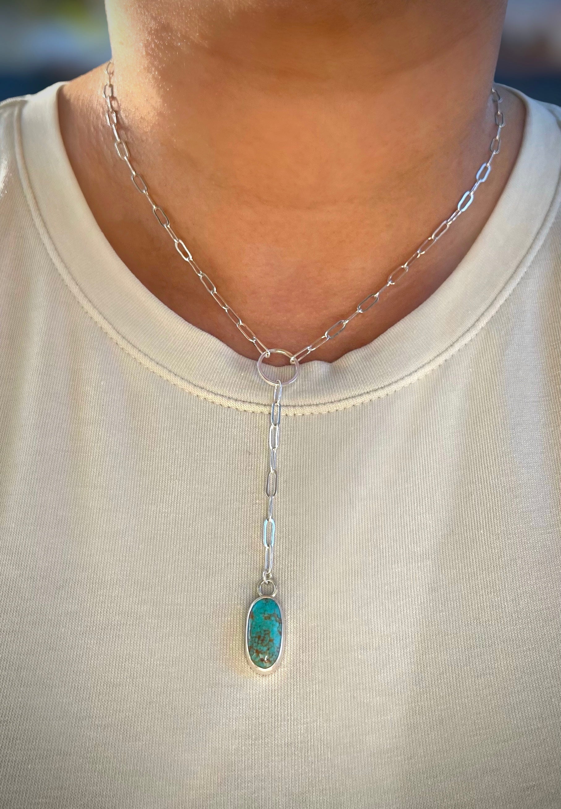 turquoise lariat necklace on sterling silver paper clip chain shown worn