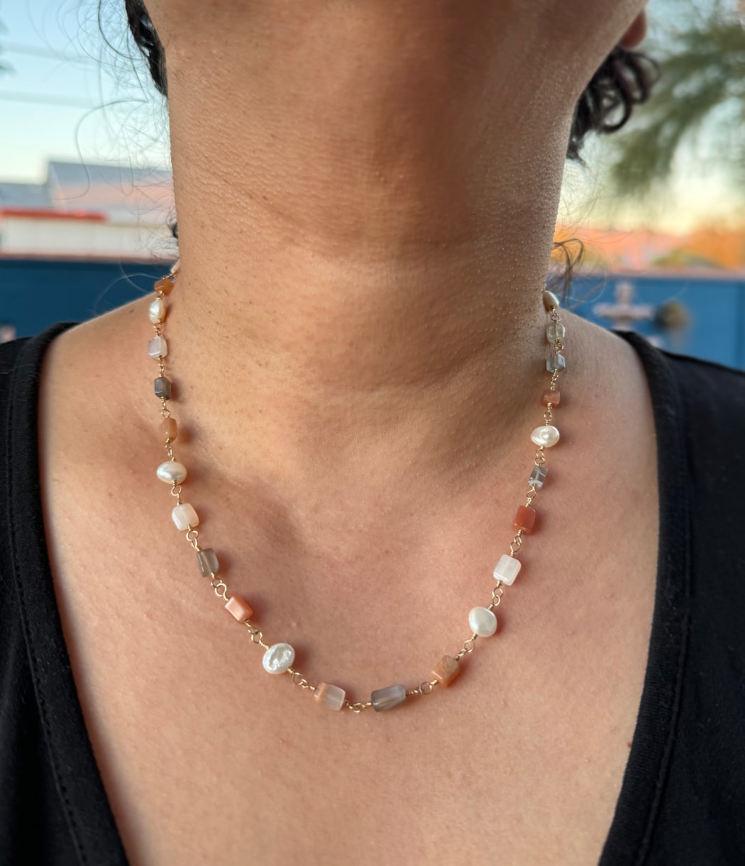 Moonstone and baroque pearl gold necklace worn