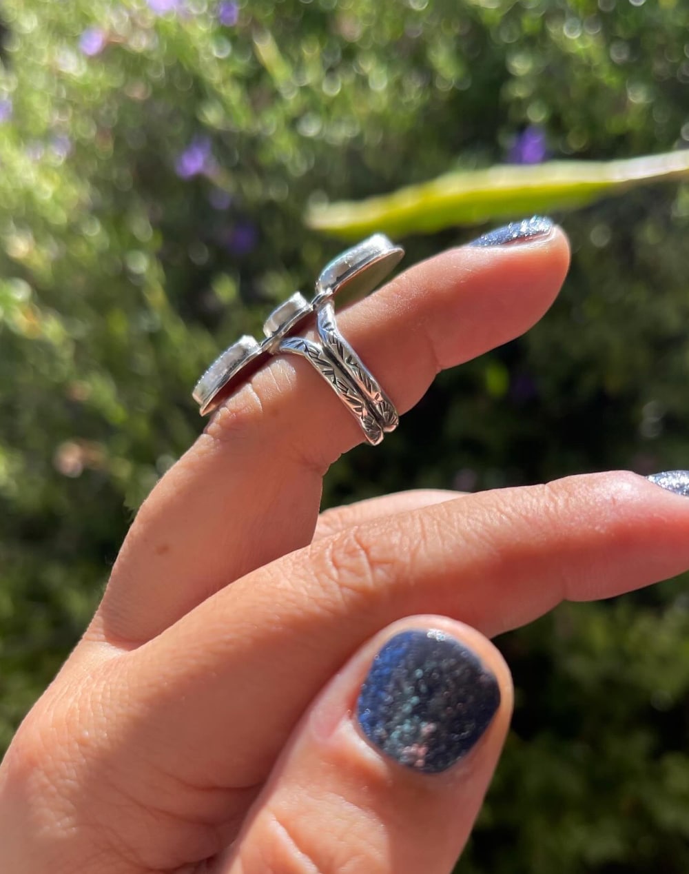 View of the stamped split ring band on sterling silver multistone ring