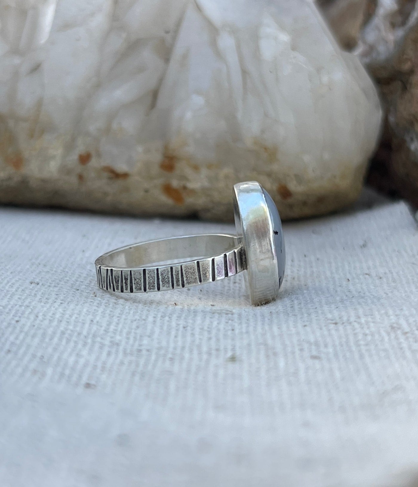 Side view line stamped band dendritic agate ring