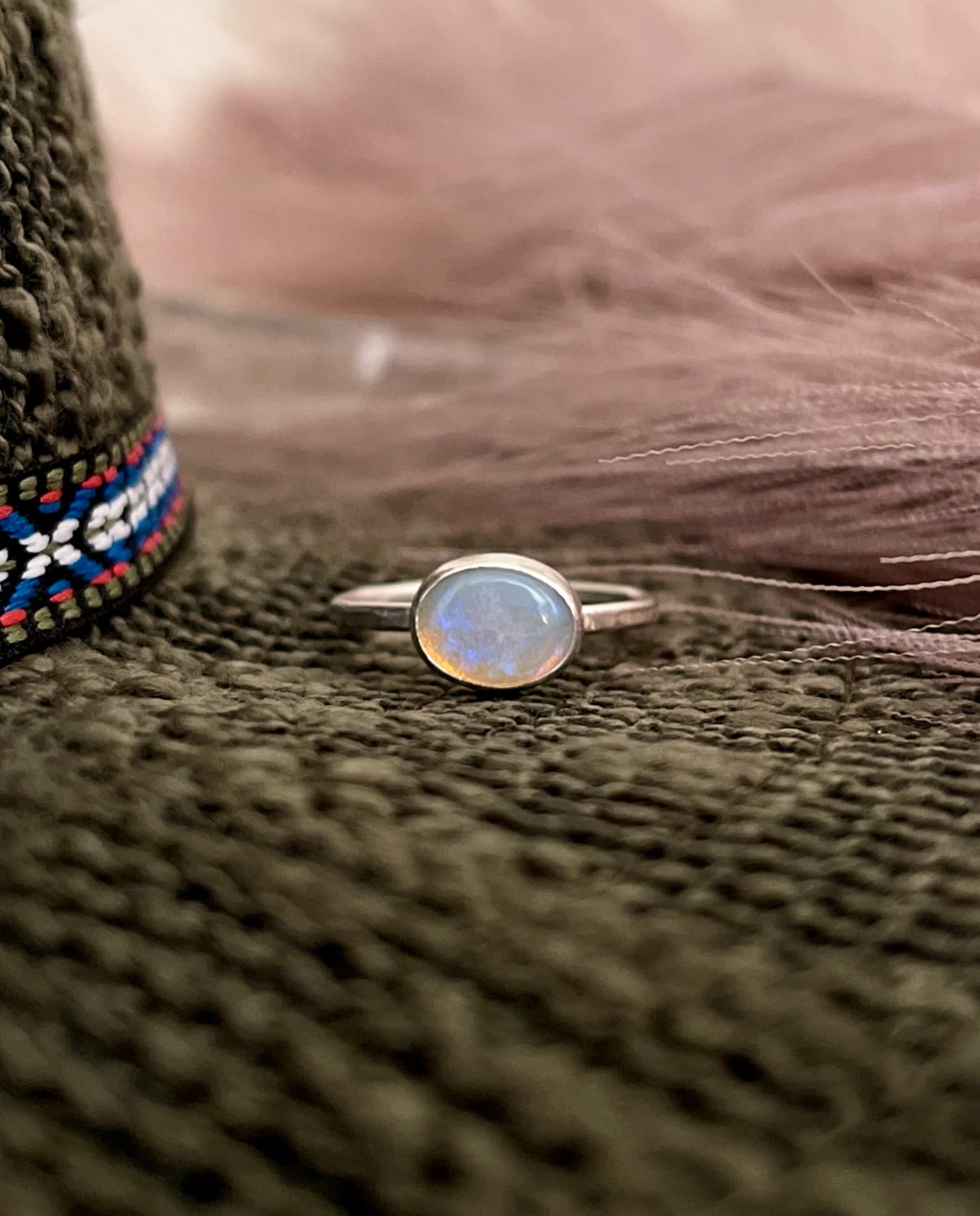 oval shaped opal set horizontally on sterling band. simple stacking ring