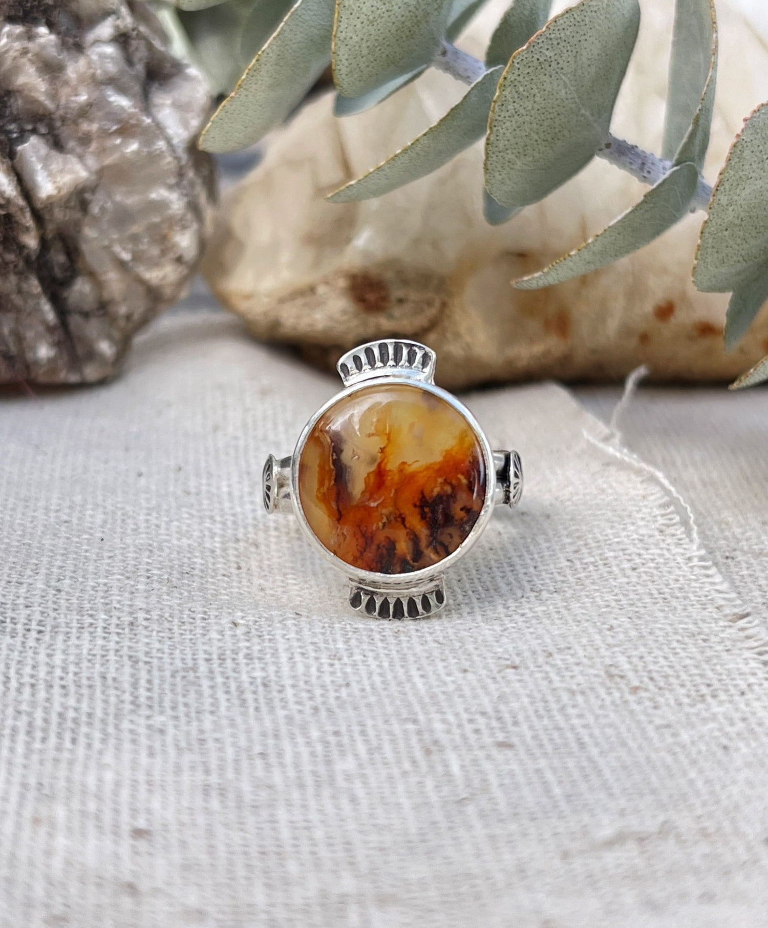 round plume agate stone with handstamped details on sterling silver band