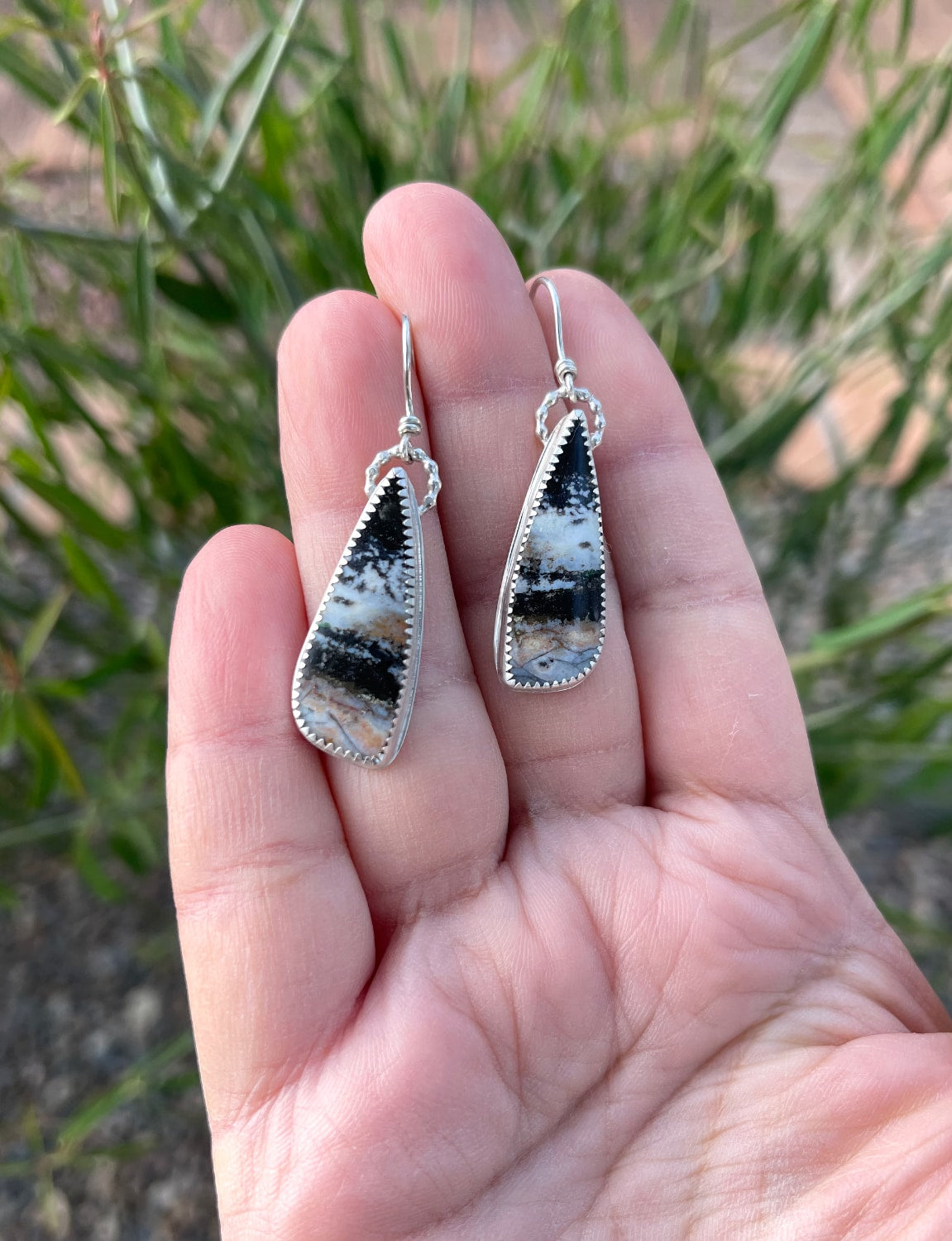 opalized petrified wood teardrop shaped dangle earrings set in serrated edge bezel with sterling silver ear wires